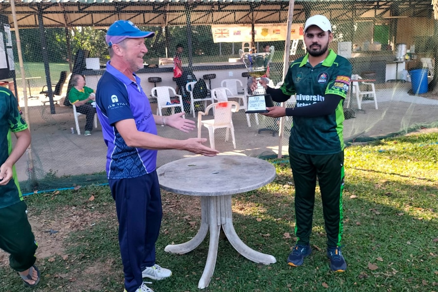 CMLCC chair Ian Harling presents the trophy to wining captain Cheema
